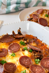 Keto pizza casserole on a light background