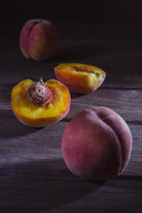 Fototapeta na wymiar Ripe juicy peaches lie on a wooden table.