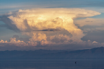Naklejka na ściany i meble Beautiful clouds over Lake Baikal