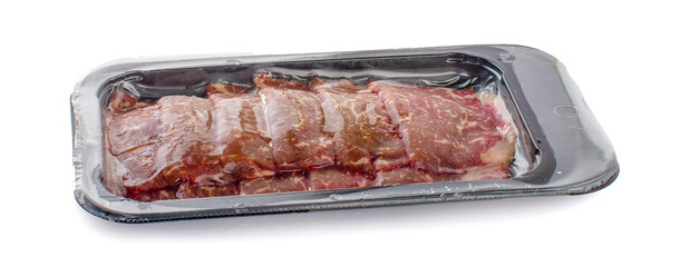 Vacuum-packed beef on a white background. Marbled beef from the store isolated on a white background