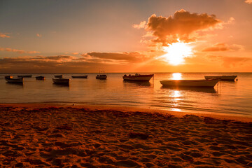 Fishing boat on the beach of Albion at sunset in the west of the republic of Mauritius, East Africa