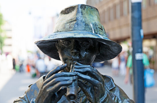Gavle, Norrland Sweden - July 12, 2021: statue depicting flute playing boy