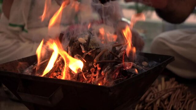 Making fire for rituals pooja and added some ghee.