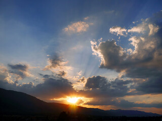 Ray of lights in the bright blue sky of dawn