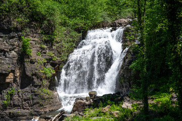 Fototapeta na wymiar Zolotonosets Waterfall in the Republic of Abkhazia. A clear sunny day on May 20, 2021