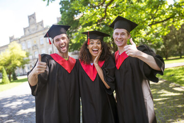 A group of graduates looking happy and excited