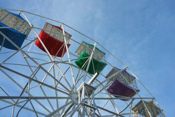 Ferris wheel on sky background