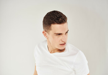 Fototapeta premium man in white t-shirt emotions angry look Studio