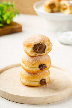 A bombolone or bomboloni is an Italian filled doughnut and is eaten as a snack food and dessert. This Bomboloni has many flavors like strawberry, chocolate, blueberry, etc.