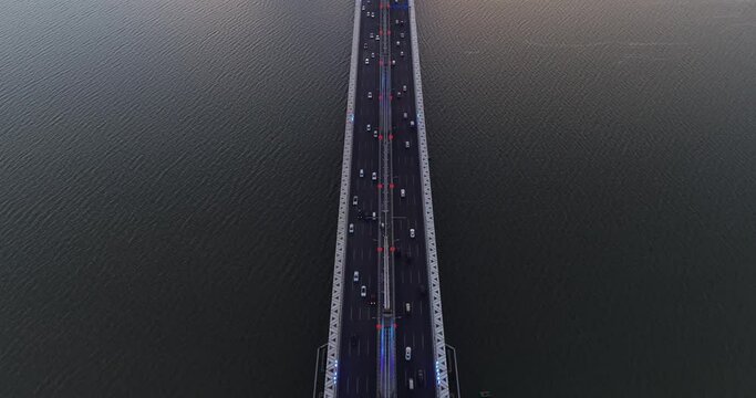 Urban road traffic, overlooking the bridge across the river