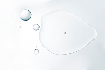 Cosmetic liquid water serum or waterproof material on white background