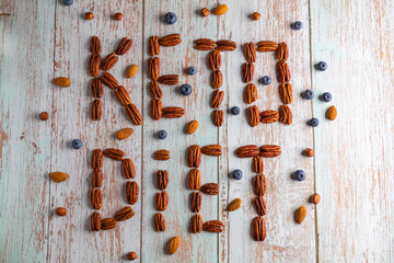 The inscription KETO DIET made from nuts, healthy fat and protein food, vegan, ketogenic diet.