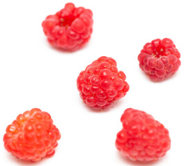 Red raspberries on a white background.