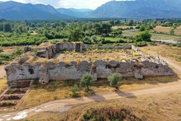 Fototapeta na wymiar Evdir Han Caravanserai was built in 1210-1219 during the Anatolian Seljuk period. The caravanserai is currently in ruins. Antalya, Turkey.
