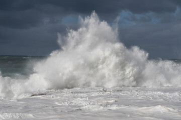wave crashing over rocks