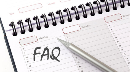 FAQ on the planner with pencil, business concept