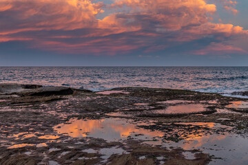 sunset reflections in rock pools