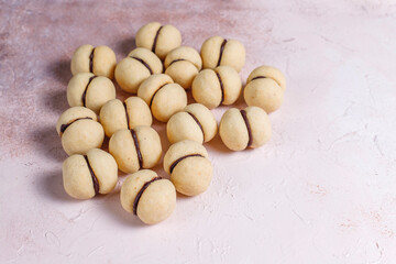 Baci di dama homemade Italian hazelnut biscuits cookies with chocolate.