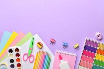 Stationery on a purple background with a place for text.
