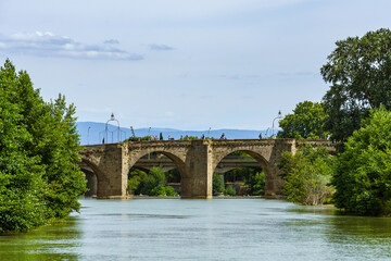 Fototapeta na wymiar Pont-Vieux Old Bridge XIV Century spans over river Aude in the French city of Carcassonne.