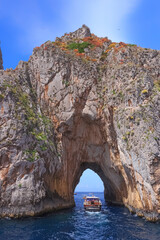 The Faraglioni Rocks on the coast of the island of Capri, Italy. Capri stacks, the symbol of the...