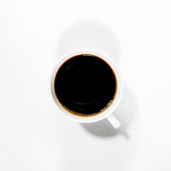 Fototapeta na wymiar photos of black coffee in a white cup from above that separate the white background. isolated photo