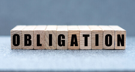 OBLIGATION - word on wooden bars on a gray background
