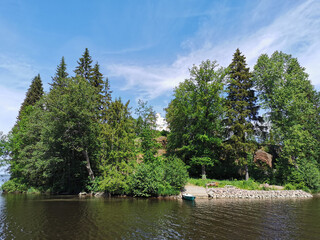 View from the shore of the Vyborg Bay to the island of Ludwigstein with the Ludwigsburg Chapel in the Monrepos Rock Nature Park in Vyborg.