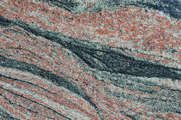 Red and black decorative granite marble background with diagonal waved stripes