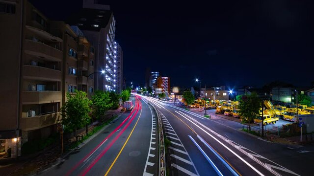 A night timelapse of traffic jam at the downtown street in Tokyo wide shot