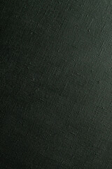 dark creative background: black primed linen canvas, uneven lighting, color toning