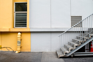 stairs on a wall with pipeline