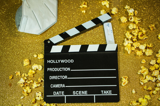 Cinema Hatch With Popcorn, Covid Test And Mask, On Golden Background