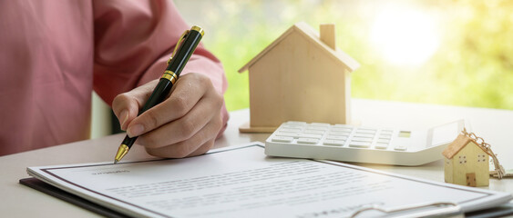 Real estate broker agent presenting and consult to customer to decision making sign insurance form...