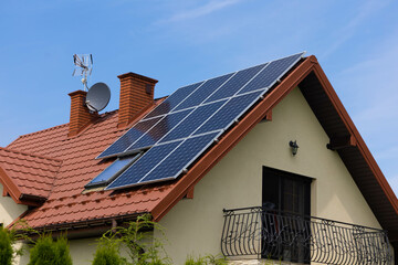 Obraz premium solar panels on a roof of house, modern power solution, environment friendly
