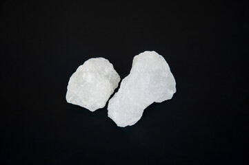 Alum stone isolated on black background..