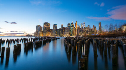 Fototapeta premium New York City skyline at sunrise, Beautiful sunrise over Manhattan office buildings, Lower Manhattan at the morning New York City.
