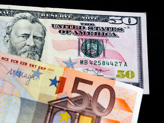 In this photo illustration background of dollar and euro bills