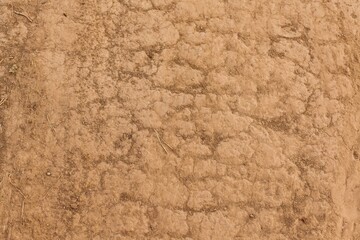 dry, stony soil of brown color with cracks. clay. nature. background. drought.