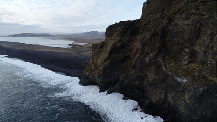 Areal view of cliffs by Reynisfjara black beach in Iceland