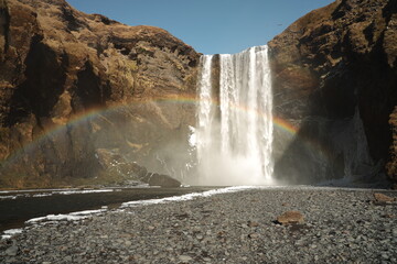 Rainbow in front of Skógarfoss waterfall in Iceland