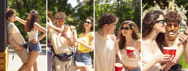 Happy attractive young couple romantically eating and drinking near mobile snack bar outdoors. Fresh, food, street, city lifestyle concept. Yummy ice-cream for man and woman