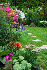 Garden with blooming flowers in the middle of the summer