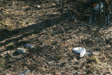 Garbage dump in the forest, plastic waste and food waste thrown in the forest. People left plastic...