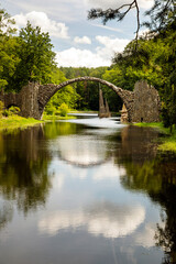 Fototapeta premium Rakotzbrucke bridge in Germany reflecting in the water