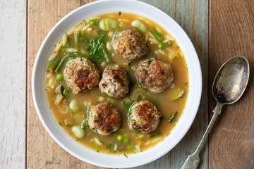 Green minestrone sopu with meat balls and orzo pasta - obrazy, fototapety, plakaty