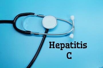 stethoscope with the word hepatitis c and a blue background