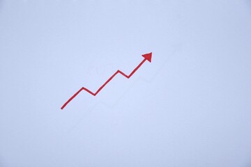Photo of a drawing of a red arrow pointing up