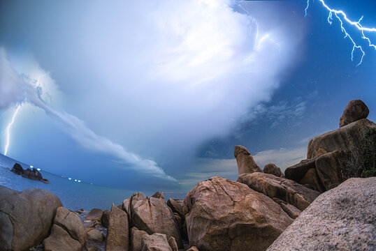 Lightning stike over the Hinta Hinyai rock beach Koh Samui ,Suratthani ,thailand	