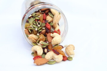 The healthy snack with ailmonds, nuts, dried grapes, pumkin seed and more of dried fruits. Focus in the middle and blurred around